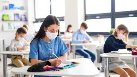 Stock photo of school with pandemic procedures in place | Copyright (c) 2020 Halfpoint/Shutterstock